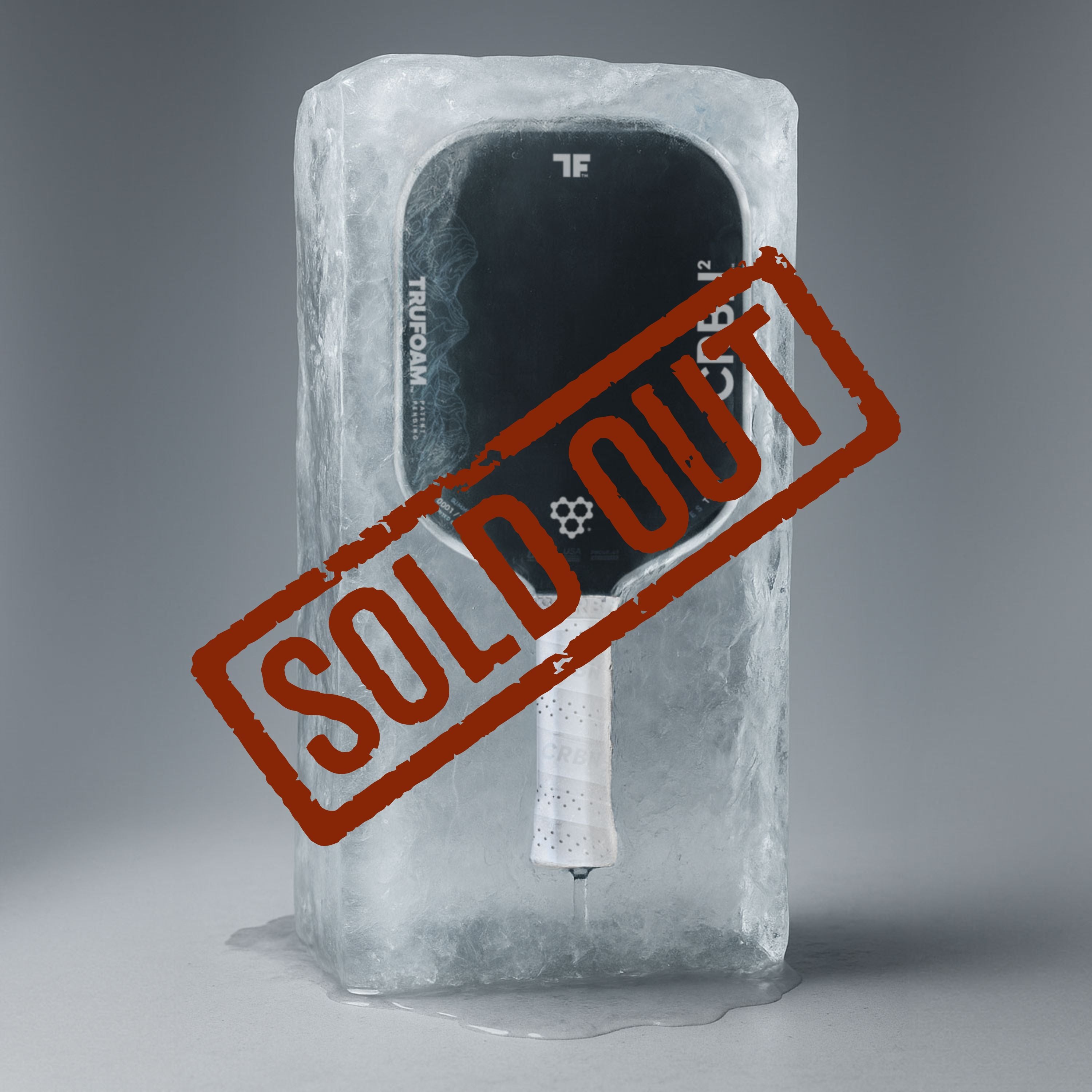CRBN² TruFoam Waves Summit paddle encased in ice with a bold SOLD OUT stamp across it