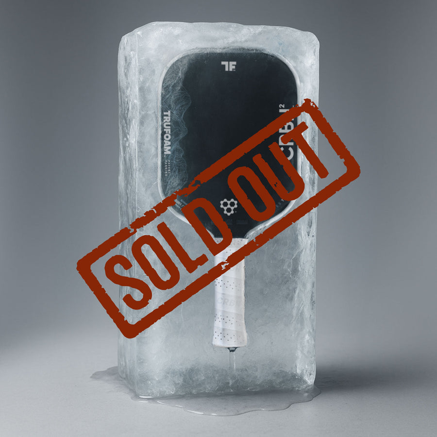 CRBN² TruFoam Waves Summit paddle encased in ice with a bold SOLD OUT stamp across it