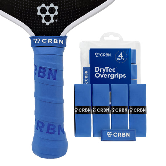 CRBN DryTec Overgrips 4-Pack in Blue, wrapped on a pickleball paddle handle beside the packaging