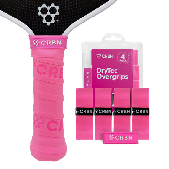 CRBN DryTec Overgrips 4-Pack in Pink, wrapped on a pickleball paddle handle beside the packaging