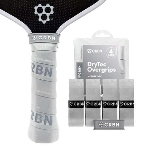 CRBN DryTec Overgrips 4-Pack in Grey, wrapped on a pickleball paddle handle beside the packaging