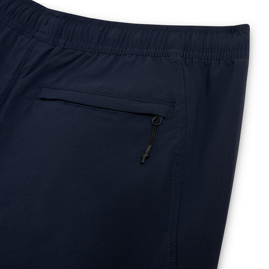 Back view of navy shorts with a zippered rear pocket.