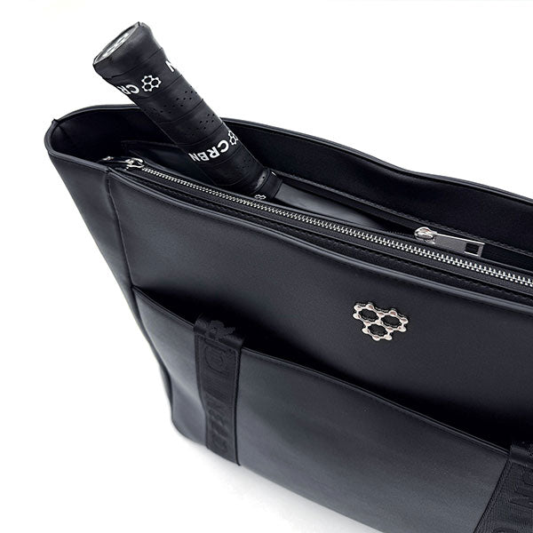 Open top view of CRBN Club Pickleball Tote Bag with a paddle partially inserted into the opening.