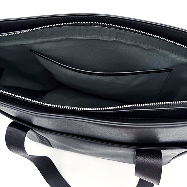 Interior view of the CRBN Club Pickleball Tote showing a zip top, large main compartment, and an interior pocket