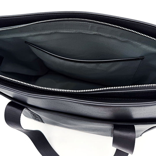 Interior view of the CRBN Club Pickleball Tote showing a zip top, large main compartment, and an interior pocket